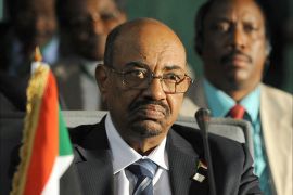 Sudan's President Omar al-Bashir takes part in the African Union Summit on health focusing on HIV/AIDS, TB and malaria in Abuja on July 15, 2013. Nigeria's presidency today defended welcoming Sudan President Omar al-Bashir to the country for an African Union health summit despite war crimes charges against him, saying it cannot interfere in AU affairs. AFP PHOTO / PIUS UTOMI EKPEI