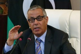 Libyan Prime Minister Ali Zaidan speaks during a press conference with Interior Minister following a rocket attack on a building located in a residential area on July 24, 2013 in Tripoli, Libya. Interior Minister said that the targetted building was the Corinthia hotel where several members of the government, diplomats and foreign businessmen were staying.