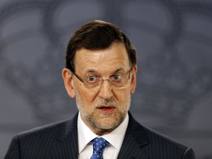 Spain's Prime Minister Mariano Rajoy speaks during a joint news conference with his Polish counterpart Donald Tusk (not pictured) at Moncloa Palace in Madrid July 15, 2013. Rajoy said on Monday he ruled out stepping down after opposition leaders called for him to leave office due to a growing scandal over alleged illegal financing of the ruling People's Party.