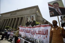 Members of the Muslim Brotherhood and supporters of ousted Egyptian President Mohamed Mursi shout slogans in front of the courthouse and the Attorney General's office during a demonstration in Cairo July 22, 2013. A panel of legal experts started work on Sunday to revise Egypt's Islamist-tinged constitution, a vital first step on the road to fresh elections ordered by the army following its removal of Mohamed Mursi as president.