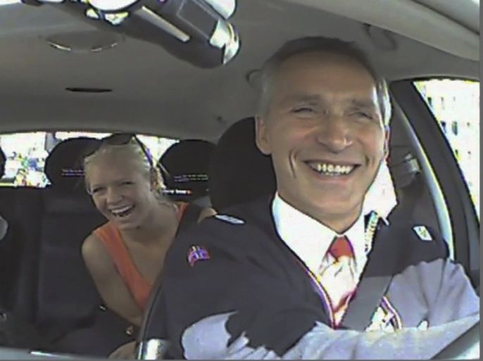 Norwegian Prime Minister Jens Stoltenberg and two passengers laugh, after they realised he was driving a taxi in Oslo, in this still image taken from video provided by the Norwegian Labour Party on August 11, 2013. Stoltenberg, who heads the Norwegian Labour Party, has revealed on his Facebook page that he spent an afternoon working as a taxi driver to hear people's views, as a part of his re-election campaign.