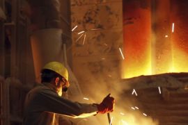 A worker controls the tapping of a blast furnace at a factory belonging to Ezz Steel, Egypt's largest steel producer, at an industrial complex in Sadat City, 94 km (58 miles) north of Cairo, April 17, 2013.