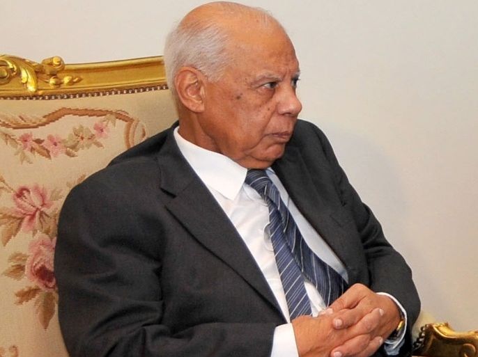 In this image released by the Egyptian Presidency, Hazem el-Beblawi meets with interim President Adly Mansour, unseen, in Cairo, Egypt, Tuesday, July 9, 2013. The spokesman of Egypt's interim president says a prominent economist, Hazem el-Beblawi, has been named prime minister and pro-democracy leader Mohamed ElBaradei as a vice-president. Ahmed el-Musalamani made the announcements Tuesday after days of political stalemate over the prime minister post. El-Beblawi, who is in his 70s, served as finance minister in one of the first cabinets formed after the 2011 uprising forced Hosni Mubarak from power and the military stepped in to rule.