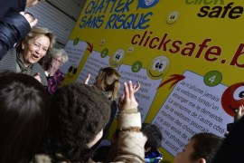 Queen Paola of Belgium talks to children during the presentation of the tenth edition of the 'Safer Internet Day' campaign of Child Focus, at the Child Focus headquarters in Brussels, on January 30, 2013.