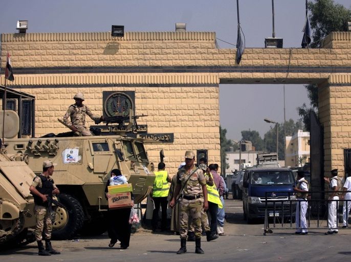 Egyptian army soldiers guard Torah Prison, where Egypt's deposed autocrat Hosni Mubarak has been held, in Cairo, Egypt, Thursday, Aug. 22, 2013. Egypt's ousted leader Hosni Mubarak has been released from jail and taken to military hospital in Cairo.