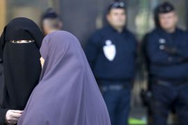 epa02929332 Women wearing niqabs in conversation as police officers stand watch in front of the courthouse in Meaux, near Paris, France, 22 September 2011. The Meaux court, on 22 September, convicted two women for wearing Islamic veils in public - the first conviction since a ban on wearing the veils came into effect in April. The court in the town of Meaux, about 40 kilometres east of Paris, fined Hind Ahmas, 32, and another woman for appearing outside the local town hall in niqabs - a veil that covers the hair and face leaving a slit for the eyes, their lawyer Gilles Devers told the German Press Agency dpa. Devers said Ahmas was fined 120 euros and the other woman 80 euros. EPA/IAN LANGSDON