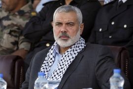 Hamas Prime Minister in the Gaza Strip Ismail Haniya looks on as he attends a Palestinian Hamas police graduation ceremony in Deir al-Balah in the central Gaza Strip, on May 28, 2013.