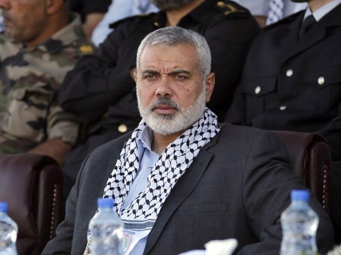 Hamas Prime Minister in the Gaza Strip Ismail Haniya looks on as he attends a Palestinian Hamas police graduation ceremony in Deir al-Balah in the central Gaza Strip, on May 28, 2013.