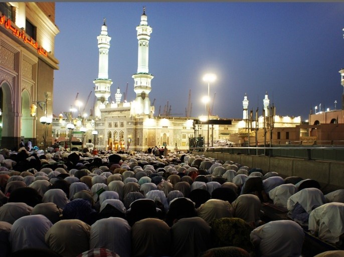 Muslim pilgrims perform the evening prayer near the Grand Mosque in the Saudi holy city of Mecca on November 12, 2010. The annual pilgrimage or hajj is one of the five pillars of Islam, which must be performed at least once in their life by all believers who have the health and the means to do so.