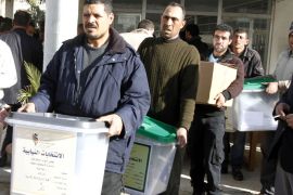 epa03550210 Jordanian workers carry ballot boxes at Ein Jaloot School in Amman, 22 January 2013. According to a media reports 47,000 security forces will guard the voting centers in the Kingdom for the parliamentary elections that will be held on 23 January 2013. EPA/JAMAL