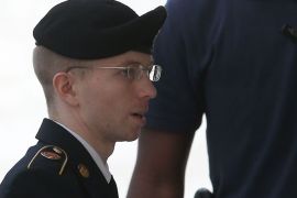 FORT MEADE, MD - AUGUST 21: US Army Private First Class Bradley Manning is escorted by military police as he arrives for his sentencing at military court facility for the sentencing phase of his trial on August 21, 2013 in Fort Meade, Maryland. Manning was found guilty of several counts under the Espionage Act, but acquitted of the most serious charge of aiding the enemy. Mark Wilson/Getty Images/AFP== FOR NEWSPAPERS, INTERNET, TELCOS & TELEVISION USE ONLY