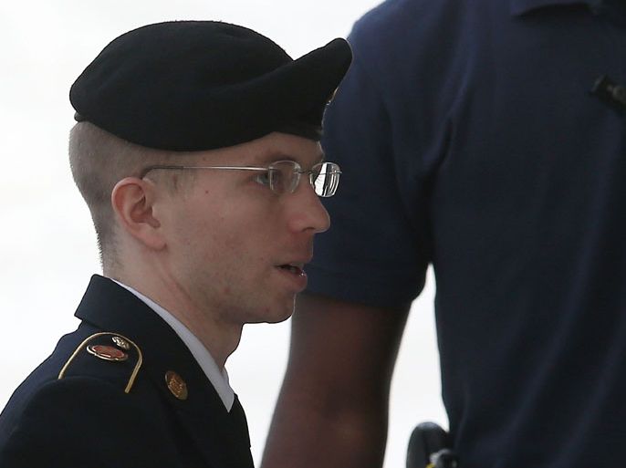 FORT MEADE, MD - AUGUST 21: US Army Private First Class Bradley Manning is escorted by military police as he arrives for his sentencing at military court facility for the sentencing phase of his trial on August 21, 2013 in Fort Meade, Maryland. Manning was found guilty of several counts under the Espionage Act, but acquitted of the most serious charge of aiding the enemy. Mark Wilson/Getty Images/AFP== FOR NEWSPAPERS, INTERNET, TELCOS & TELEVISION USE ONLY