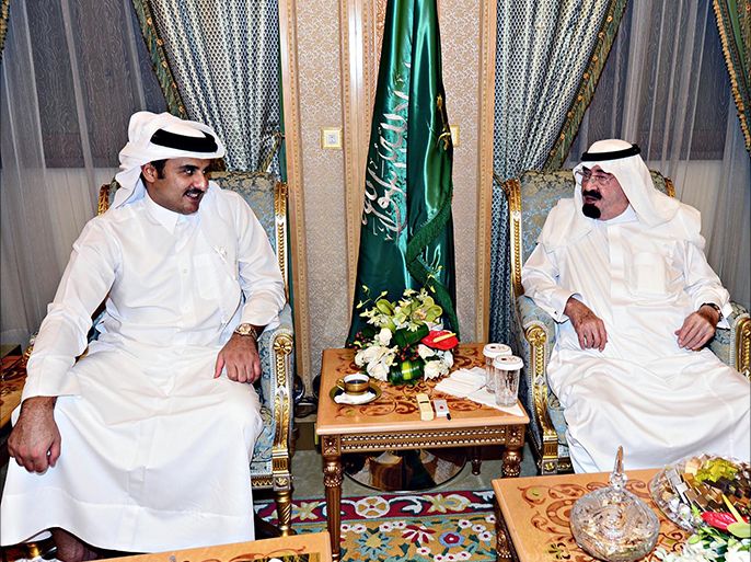 A handout picture released by the Saudi Press Agency (SPA) shows the new Emir of Qatar Sheikh Tamim bin Hamad al-Thani (L) meeting King Abdullah in Mecca on August 2, 2013. Sheikh Tamim is on his first foreign foray since acceding to the throne in June to meet King Abdullah and perform the omra" pilgrimage to Mecca, Islam's holiest site, the Saudi Press agency said. AFP PHOTO/HO/SPA == RESTRICTED TO EDITORIAL USE - MANDATORY CREDIT "AFP PHOTO/HO/SPA" - NO MARKETING NO ADVERTISING CAMPAIGNS - DISTRIBUTED AS A SERVICE TO CLIENTS ==