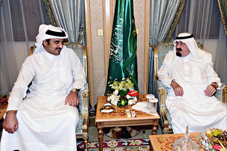 A handout picture released by the Saudi Press Agency (SPA) shows the new Emir of Qatar Sheikh Tamim bin Hamad al-Thani (L) meeting King Abdullah in Mecca on August 2, 2013. Sheikh Tamim is on his first foreign foray since acceding to the throne in June to meet King Abdullah and perform the omra" pilgrimage to Mecca, Islam's holiest site, the Saudi Press agency said. AFP PHOTO/HO/SPA == RESTRICTED TO EDITORIAL USE - MANDATORY CREDIT "AFP PHOTO/HO/SPA" - NO MARKETING NO ADVERTISING CAMPAIGNS - DISTRIBUTED AS A SERVICE TO CLIENTS ==