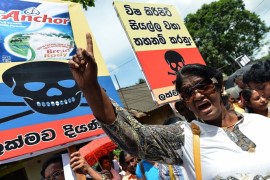 Pro-government activists demonstrate against the alleged contamination of milk powder in front of the factory of New Zealand dairy giant Fonterra in the Colombo suburb of Biyagama on August 22, 2013. A Sri Lankan court has already temporarily banned the sale of Fonterra products in the country following a public interest litigation based on the global botulism scare involving some of Fonterras milk products.