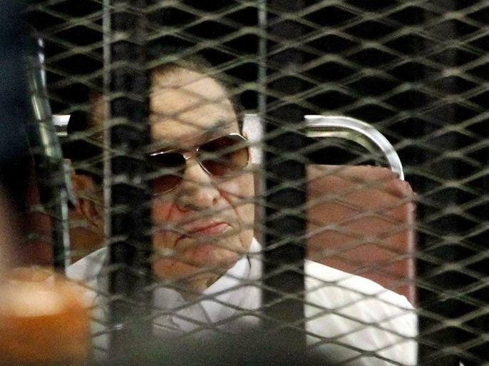 Former Egyptian president Hosni Mubarak is seen behind bars during his retrial on August, 25 2013 in Cairo. An Egyptian court on Sunday adjourned the murder and corruption retrial of former strongman Hosni Mubarak, his sons and security commanders to September 14. Mubarak, who was freed from prison and placed under house arrest earlier in the week, attended the retrial, along with the other defendants.