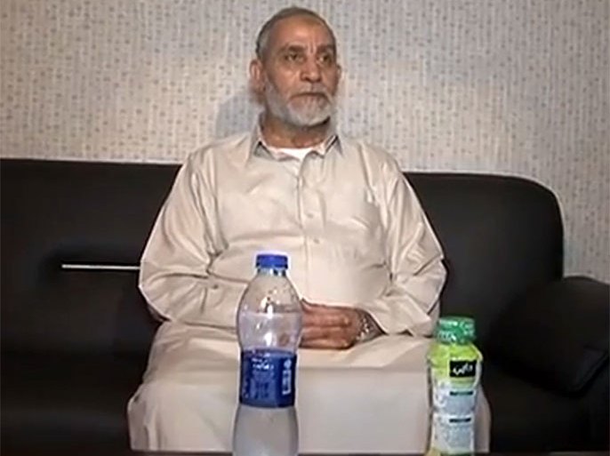 An image grab from a video released by the Egyptian Interior Ministry on its Youtube page allegedly shows Mohamed Badie (C), the supreme guide of the Muslim Brotherhood, following his arrest in the early hours of August 20, 2013 in Cairo's Nasr City district. Egyptian authorities said they had arrested Badie, as they stepped up a campaign to crush the party of ousted president Mohamed Morsi. He was arrested in an apartment near Rabaa al-Adawiya square, where more than 200 Morsi supporters were killed last week as police cleared their protest camp, the interior ministry said, according to state television. AFP PHOTO/ HO/Egyptian Interior Ministry === RESTRICTED TO EDITORIAL USE - MANDATORY CREDIT "AFP PHOTO /HO /Egyptian Interior Ministry" - NO MARKETING NO ADVERTISING CAMPAIGNS - DISTRIBUTED AS A SERVICE TO CLIENTS