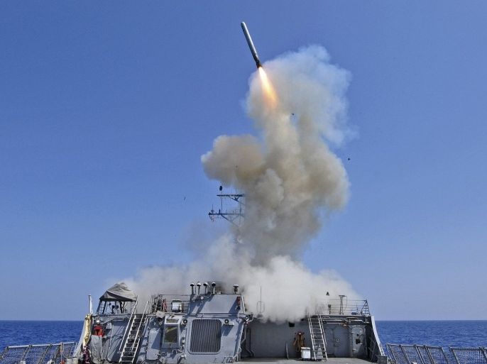 The guided-missile destroyer USS Barry launches a Tomahawk cruise missile from the ship's bow in the Mediterranean Sea in this U.S. Navy handout photo taken March 29, 2011. Barry is one of four U.S. destroyers currently deployed in the Mediterranean Sea equipped with long-range Tomahawk missles that could potentially be used to strike Syria, according to officials.