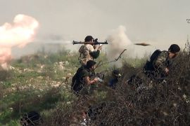 An image grab taken from a video shows an opposition fighter firing an rocket propelled grenade (RPG) on August 26, 2013 during clashes with regime forces over the strategic area of Khanasser, situated on the only road linking Aleppo to central Syria. Rebels had in recent days captured several villages in Aleppo province, much of which is already in the hands of anti-regime fighters, before taking Khanasser, situated on the highway to Hama in central Syria, thus cutting the army's only supply route to the northern province.
