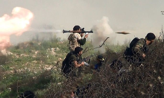 An image grab taken from a video shows an opposition fighter firing an rocket propelled grenade (RPG) on August 26, 2013 during clashes with regime forces over the strategic area of Khanasser, situated on the only road linking Aleppo to central Syria. Rebels had in recent days captured several villages in Aleppo province, much of which is already in the hands of anti-regime fighters, before taking Khanasser, situated on the highway to Hama in central Syria, thus cutting the army's only supply route to the northern province.