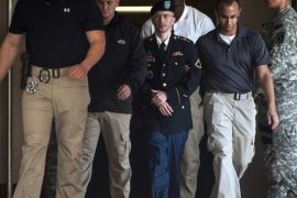 Private First Class Bradley Manning is escorted out of court after testifying in the sentencing phase of his military trial at Fort Meade, Maryland August 14, 2013. Manning on Wednesday told a military court "I'm sorry" for giving war logs and diplomatic secrets to the WikiLeaks website three years ago, the biggest breach of classified data in the nation's history.