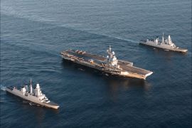 epa02983140 (FILE) A French Navy handout released on 20 April 2010 and reissued on 28 october 2011 shows an aerial view of aircraft carrier 'Charles De Gaulle' (C) between French Horizon Class Destroyers 'Forbin' (front) and 'Chevalier Paul' (back) at sea in an undisclosed location on 28 March 2010 during NATO maneuvers inside the Polar Arctic Circle. NATO's job in Libya 'is done,' NATO Secretary General Anders Fogh Rasmussen said on 28 October 2011, as he announced on twitter that military operations in the country would end on 31 October. EPA/MARINE NATIONALE / HANDDOUT EDITORIAL USE ONLY/NO SALES