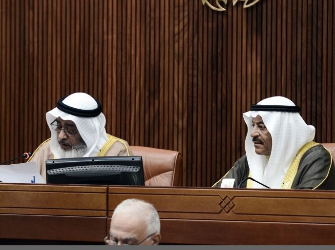 Bahraini House of Representatives' Speaker, Khalifa bin Ahmed Al-Dhahrani (L) and Shura Council Chairman Ali bin Saleh Al-Salah (R) take part in an extraordinary special meeting of the Bahrain Shura Council and House of Representatives in Manama, on July 28, 2013.