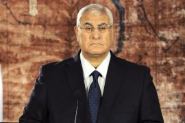 In this Monday, July 22, 2013 image released by the Egyptian Presidency, Egypt's interim President Adly Mansour calls for reconciliation in a nationally televised speech in Cairo, Egypt. "We ... want to turn a new page in the nation's book," he said."No contempt, no hatred, no divisions and no collisions."