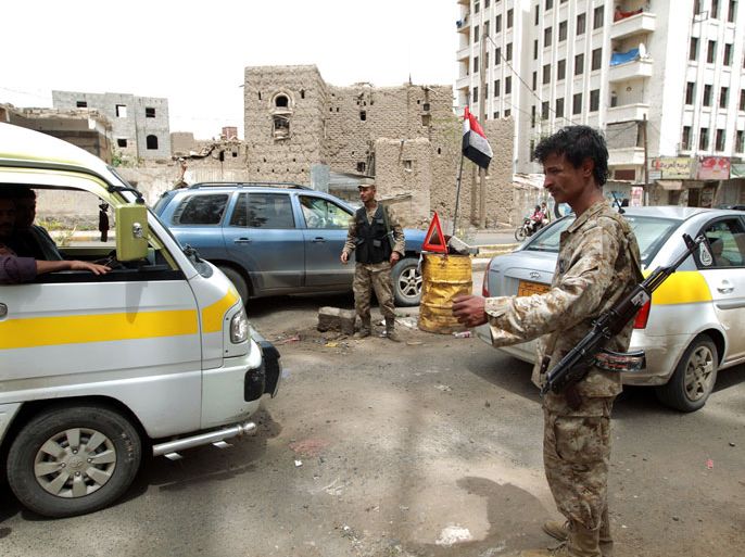 Yemeni police, man a check point, in the capital Saana on August 3, 2013. The United States issued a worldwide warning that Al-Qaeda may attack in August as it ordered shut its embassies across the Islamic world. Britain also said it would temporarily close its embassy in Yemen as US lawmakers said the threat likely involved Al-Qaeda's franchise in the country. AFP PHOTO/ MOHAMMED HUWAIS