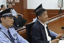 This screen grab taken from state television CCTV footage broadcast on August 25, 2013 shows ousted Chinese political star Bo Xilai (R) speaking in the courtroom as he stands trial at the Intermediate People's Court in Jinan, in eastern China's Shandong province. Fallen Chinese politician Bo Xilai accused his former police chief of being a liar and fraudster on August 25, the fourth day of a dramatic corruption trial that has gripped the nation. CHINA OUT AFP PHOTO