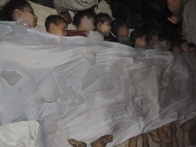 A view shows bodies of children covered with ice whom activists say were killed by gas attack in al-Ghouta area, in the eastern suburbs of Damascus, August 21, 2013. Syria's opposition accused President Bashar al-Assad's forces of gassing many hundreds of people - by one report as many as 1,300 - on Wednesday in what would, if confirmed, be the world's worst chemical weapons attack in decades.