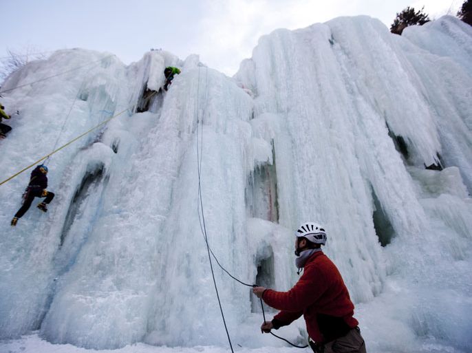 epa03563749 Students of an ice-climbing course by the Chinese Mountaineering Association scale a frozen artificial waterfall in Taoyuan Fairy Valley in Miyun County of Beijing, China, 01 February 2013. Taoyuan Fairy Valley is a popular site for ice climbers during the winter ice climbing season from 01 January to end of February. The valley features two artificial waterfall of about 20 m and 40 m high which when frozen during the winter creates immense sheer ice walls for the climbers. Entrance fee to the valley is 40 RMB (4.69 euros) per person. EPA/HOW HWEE YOUNG