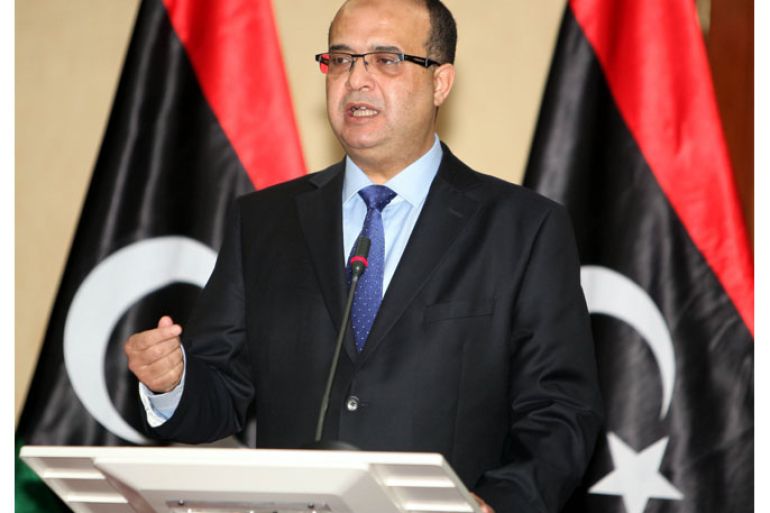 epa03518580 Libyan Deputy Prime Minister Awad al-Baraasi speaks during a press conference in Tripoli, Libya, 27 December 2012. According to local media reports, the prime minister’s office issued a statement criticizing alleged attempts by some people to slow down national companies, oil and transport sectors by staging sit-ins and strikes. EPA/SABRI ELMHEDWI