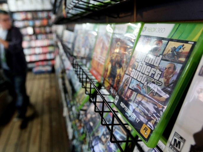 NEW YORK, NY - SEPTEMBER 18: A display copy of Grand Theft Auto V (R) sits on a shelf at the 8 Bit & Up video games shop in Manhattan's East Village on September 18, 2013 in New York City. The video game raked in more than $800 million in sales in its first 24 hours on the shelves.