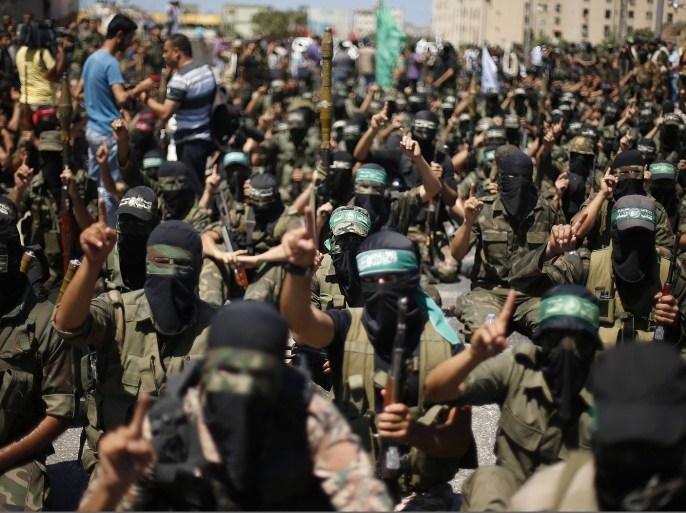 Palestinian militants take part in a protest against peace talks between Israel and the Palestinians, as well as possible U.S. attacks on Syria, in the northern Gaza Strip September 6, 2013. The protest was organized by Hamas militants and other Palestinian factions.