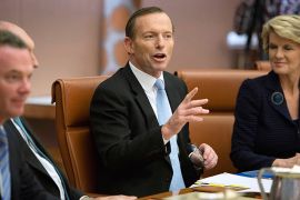 New Australian Prime Minister Tony Abbott (C) chairs the first meeting of the full ministry at Parliament House in Canberra on September 18, 2013