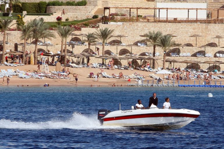 epa02484256 A police boat patrols the coast at the Red Sea resort of Sharm el Sheik, Egypt, 07 December 2010. A German tourist has been killed after a shark attack in the Red Sea off Sharm el-Sheikh, Egypt on 05 December 2010, Egyptian officials have subsequently imposed a 72-hour swimming ban in part of the area, one of Egypt's most popular tourist destinations. EPA/KHALED EL FIQI