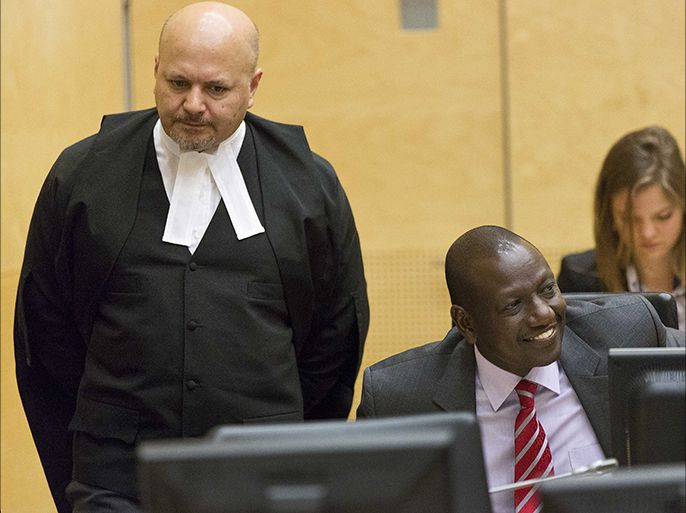 epa03860483 Kenyan Deputy President William Ruto (R) as he sits in the courtroom before his trial at the International Criminal Court (ICC) in The Hague, The Netherlands, 10 September 2013. This marks the first time a sitting leader of government is tried by the world's only permanent court for the most severe war crimes. EPA/MICHAEL KOOREN / POOL