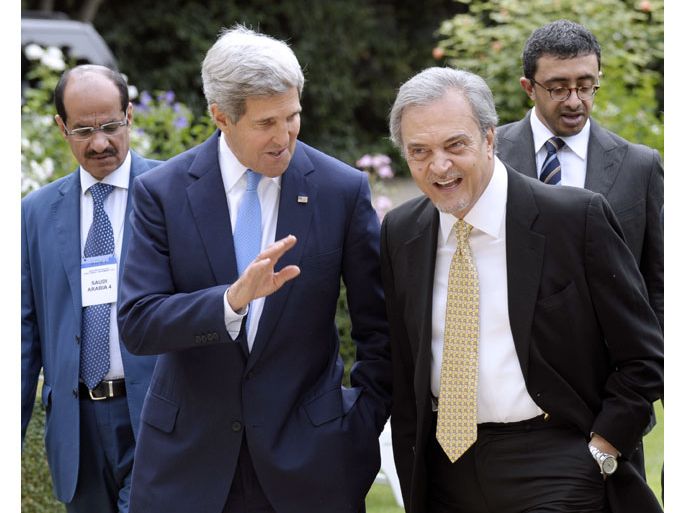 Paris, Paris, FRANCE : US Secretary of State John Kerry (2ndL) talks with Saudi Foreign Minister Saud al Faisal, (C) following a meeting with Arab League representatives at the United States Embassy in Paris, on September 8, 2013. Kerry continues a diplomatic offensive in Europe on September 8 to win backing for military strikes in Syria, after Washington and Paris said support for action was growing. Heading into a crucial week for US plans to launch the strikes, Kerry was meeting with Arab League ministers in Paris and was set to head to London next before returning to Washington on September 9 to continue rallying support at home. AFP PHOTO / POOL / SUSAN WALSH