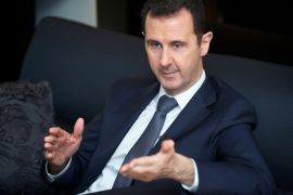 Syria's president Bashar al-Assad gestures during an interview with French daily Le Figaro in Damascus in this handout distributed by Syria's national news agency SANA on September 2, 2013.