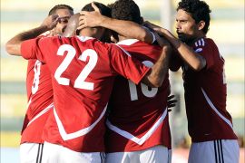 Egypt's players celebrate after scoring against Guinea during their FIFA 2014 World Cup qualifying football match at Al-Gouna stadium on September 10, 2013 in Egypt's Red Sea resort of Al-Gouna. AFP PHOTO / STRINGER
