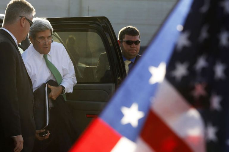 TEL AVIV, -, - : US Secretary of State John Kerry gets out of his car before boarding his plane at the Ben Gurion International Airport in Tel Aviv, Israel, on September 15, 2013. The threat of US military action against Syria remains "real", Washington's top diplomat said during his visit in Israel a day after striking a deal with Russia to destroy Damascus's chemical weapons stockpile. AFP PHOTO / POOL /LARRY DOWNING