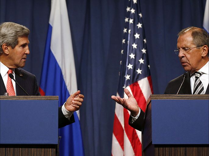 U.S. Secretary of State John Kerry (L) and Russian Foreign Minister Sergei Lavrov gesture, following meetings regarding Syria, at a news conference in Geneva September 14, 2013. The United States and Russia have agreed on a proposal to eliminate Syria's chemical weapons arsenal, Kerry said on Saturday after nearly three days of talks with Lavrov. REUTERS/Larry Downing (SWITZERLAND - Tags: POLITICS CIVIL UNREST)