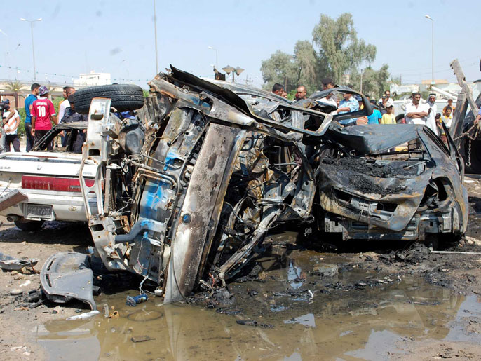 موقع انفجار سيارة ملغمة في وقت سابق بالناصرية جنوبي بغداد (الفرنسية-أرشيف)