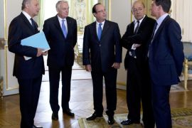 France's President Francois Hollande (C) speaks with (fromL) French Foreign minister Laurent Fabius, Prime minister Jean-Marc Ayrault, Defense minister Jean-Yves Le Drian and Interior minister Manuel Valls on August 28, 2013 at the Elysee palace in Paris. Hollande upped the ante on Syria on August 27, 2013 pledging to 'punish' the regime over suspected chemical attacks and boost military support for the opposition. The French Parliament will hold an emergency session to debate the Syria crisis on September 4, minister Alain Vidalies said today. The announced debate comes as France and its allies weigh a potential military intervention in Syria following an alleged chemical weapons attack last week in the Damascus suburbs that the West blames on the regime.