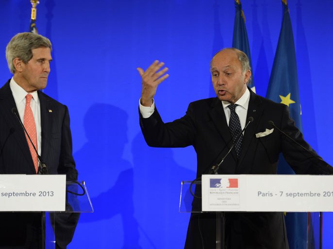 French Foreign Affairs Minister Laurent Fabius (R) and US Secretary of State John Kerry give a press conference at the ministry in Paris, on September 7, 2013. Kerry traveled to Europe to court international support for a possible strike on the Syrian regime for its alleged use of chemical weapons while making calls back home to lobby Congress where the action faces an uphill battle. AFP PHOTO / LIONEL BONAVENTURE