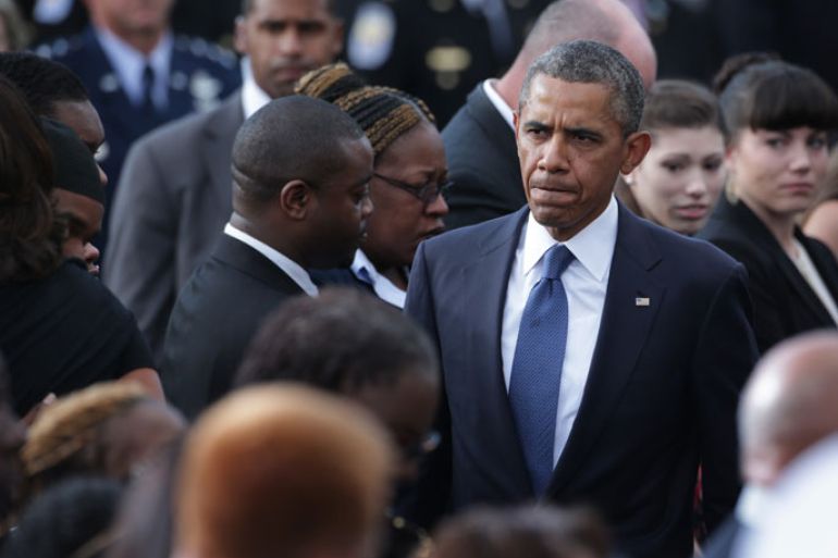 U.S. President Barack Obama attends a memorial service for victims of the Washington Navy Yard shooting at the Marine Barracks September 22, 2013 in Washington, DC. The president and the first lady visited with families of the victims in the deadly shooting at the Washington Navy Yard. Thirteen people, including the gunman Aaron Alexis, were killed in the incident