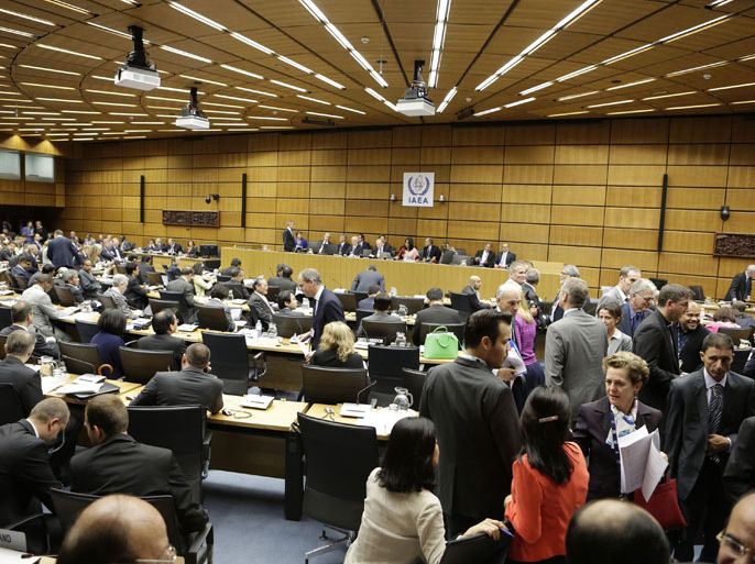 236 - Vienna, -, AUSTRIA : Participants arrive at the board room on the first day of the board of governors' meeting of the International Atomic Energy Agency (IAEA) on September 9, 2013 at the UN headquaters in Vienna. AFP PHOTO / DIETER NAGL