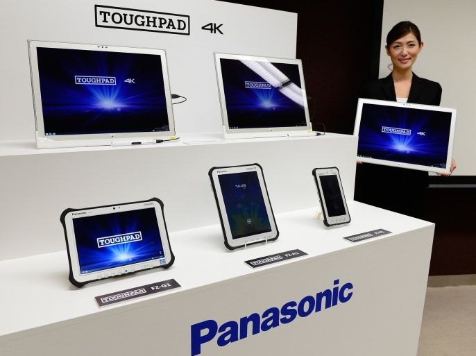 A model of Japan's electronics giant Panasonic introduces its new tablet personal computer 'TOUGHPAD 4K UT-MB5' equipped with Windows 8.1 during a press conference in Tokyo on September 6, 2013. Panasonic will put the 20-inch LCD tablet PC on the domestic and European market from December and on the US market from January at ean xpected price of 4,500 USD.