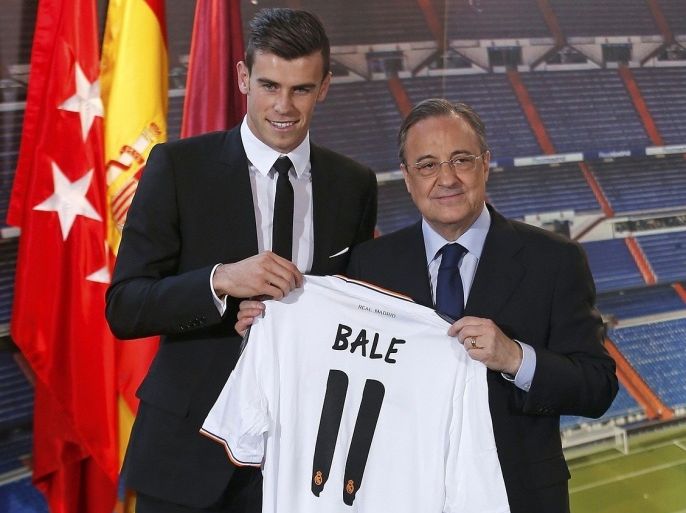 Gareth Bale of Wales hold his new Real Madrid soccer club jersey accompanied by president Florentino Perez at the Santiago Bernabeu stadium in Madrid. REUTERS/Sergio Perez. REUTERS NEWS PICTURES HAS NOW MADE IT EASIER TO FIND THE BEST PHOTOS FROM THE MOST IMPORTANT STORIES AND TOP STANDALONES EACH DAY. Search for "TPX" in the IPTC Supplemental Category field or "IMAGES OF THE DAY" in the Caption field and you will find a selection of 80-100 of our daily Top Pictures.